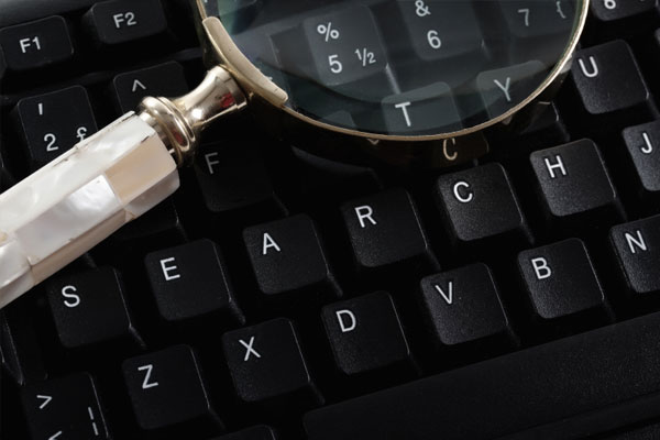 Keyboard and Magnifying Glass