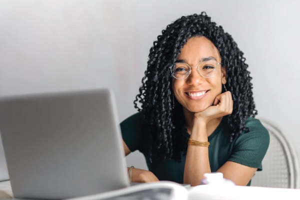 Woman smiling on computer